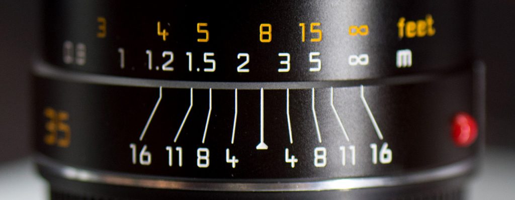 Distance scale (top) and depth of field scale (bottom) on a Leica Summarit-M 35 mm f/2.4 ASPH manual focus lens.